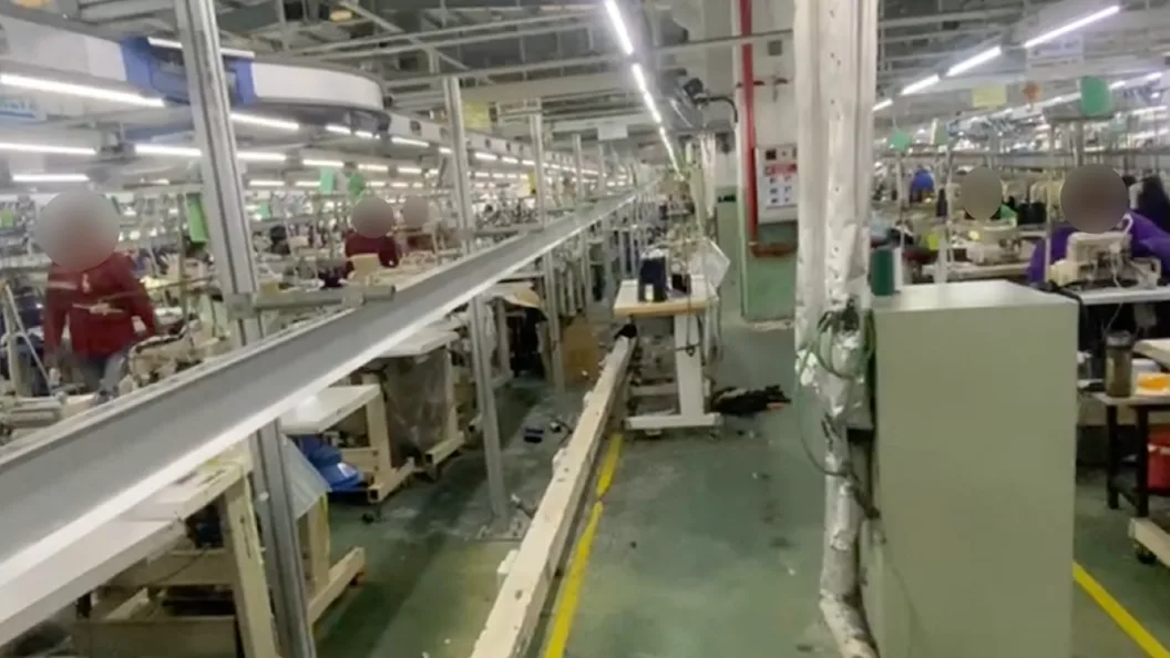 A photograph of workers inside Bowker Garment Factory.