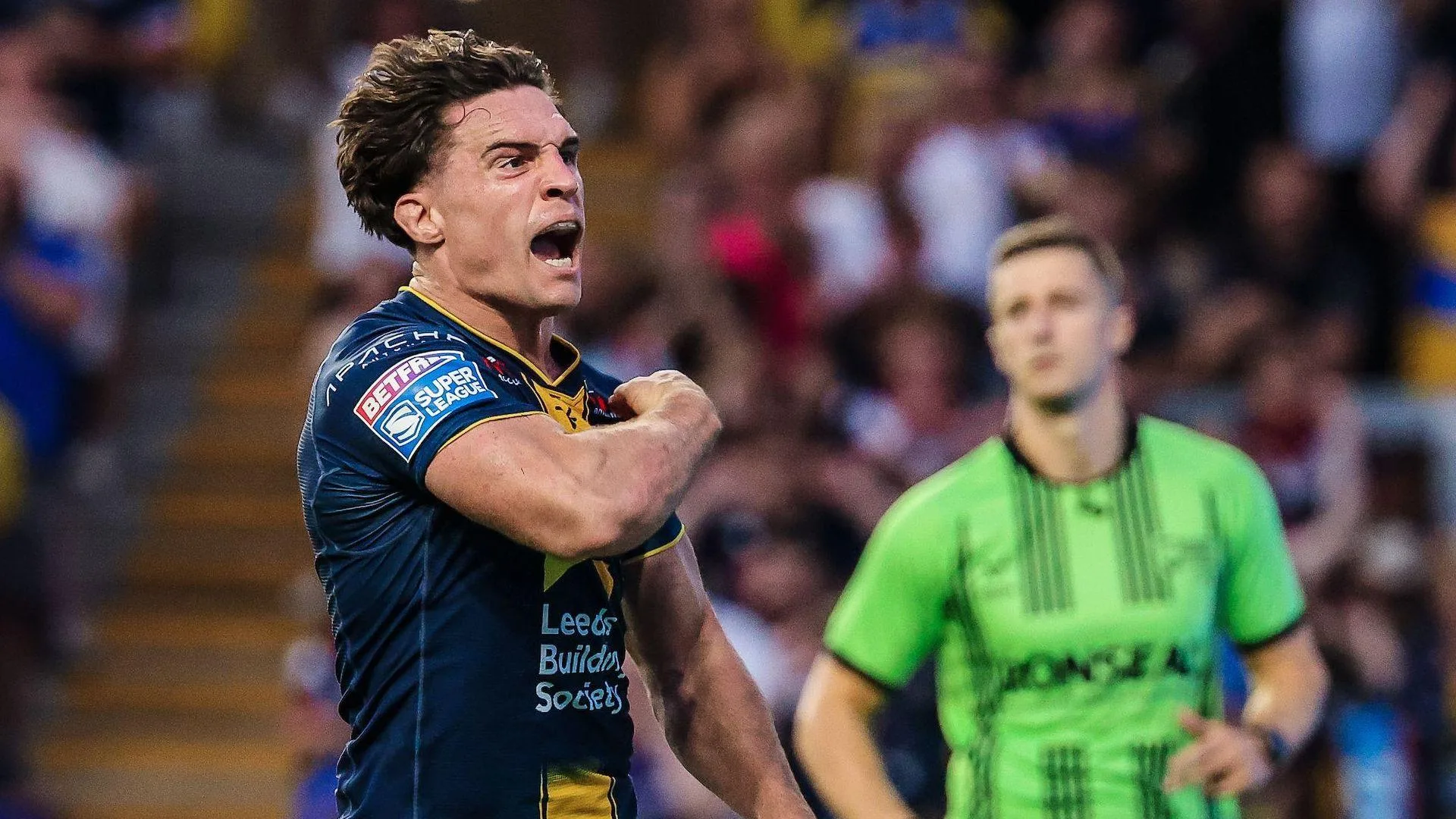 Brodie Croft roars in delight after scoring, pumping his muscles with passion in celebration