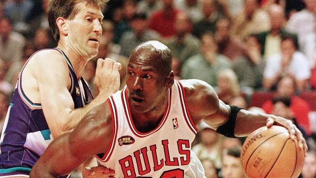 Michael Jordan of the Chicago Bulls goes to the basket past Jeff Hornacek of the Utah Jazz during game three of the 1998 NBA Finals