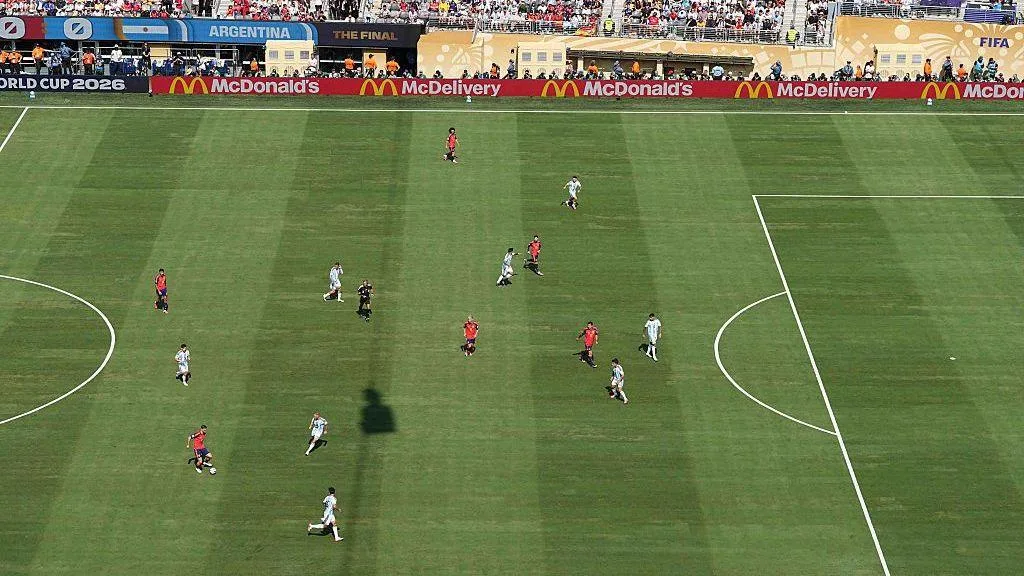 An aerial view of the 2026 Fifa World Cup final between Spain and Argentina at MetLife Stadium in New Jersey, USA, with McDonald's advertisements visible on electronic hoardings