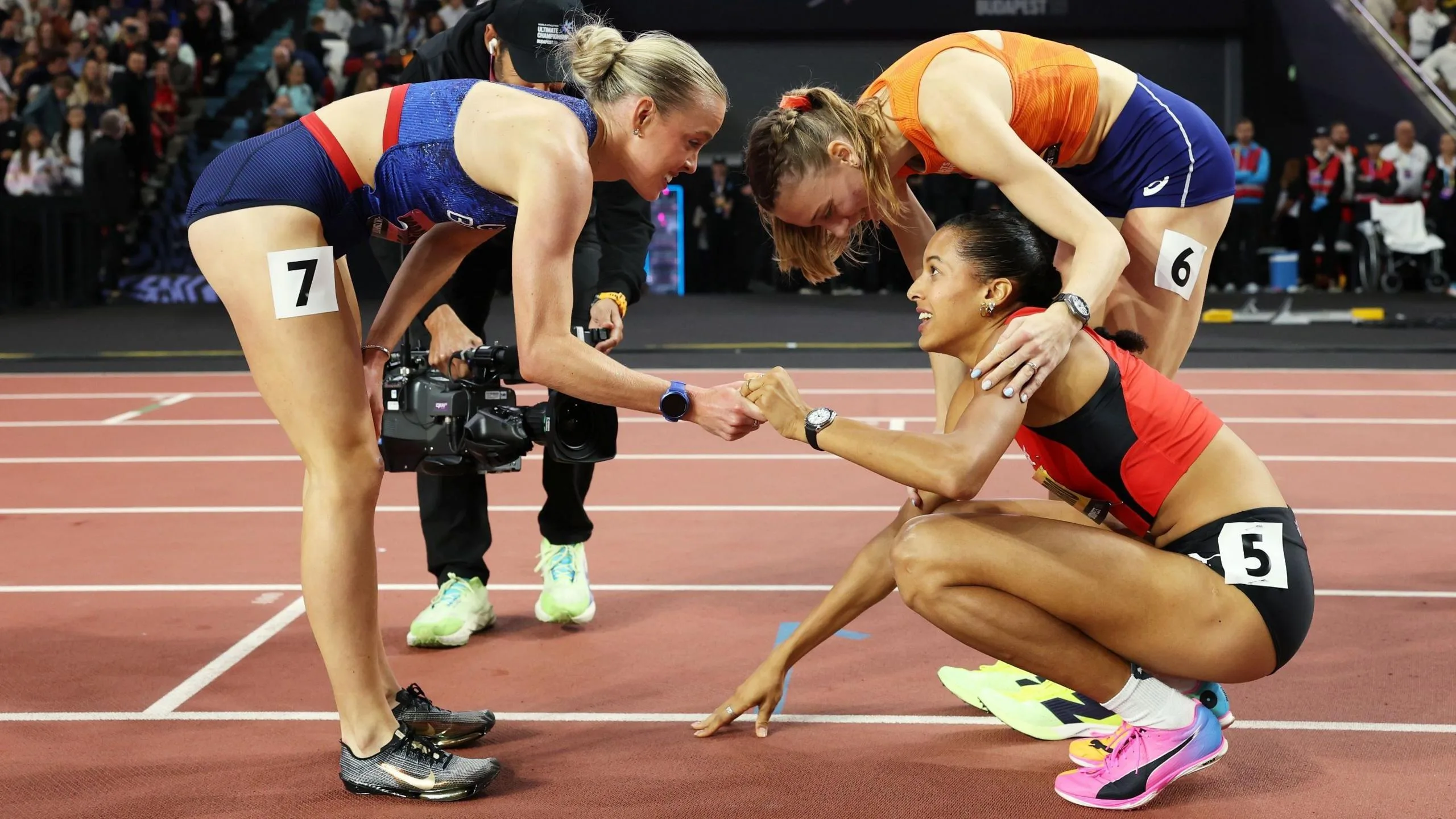 Keely Hodgkinson and Femke Broeders-Bol congratulate Audrey Werro on her victory at the Ultimate Championship