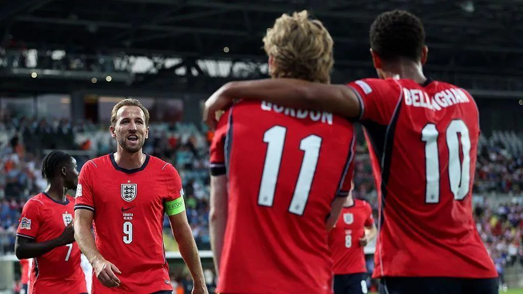 Harry Kane, Anthony Gordon and Jude Bellingham celebrate an England goal.