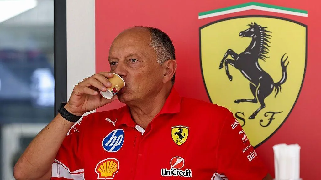 Fred Vasseur drinks a coffee while in the paddock in Malaysia