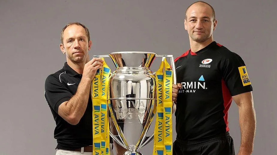 Brendan Venter poses with the Premiership trophy alongside Steve Borthwick