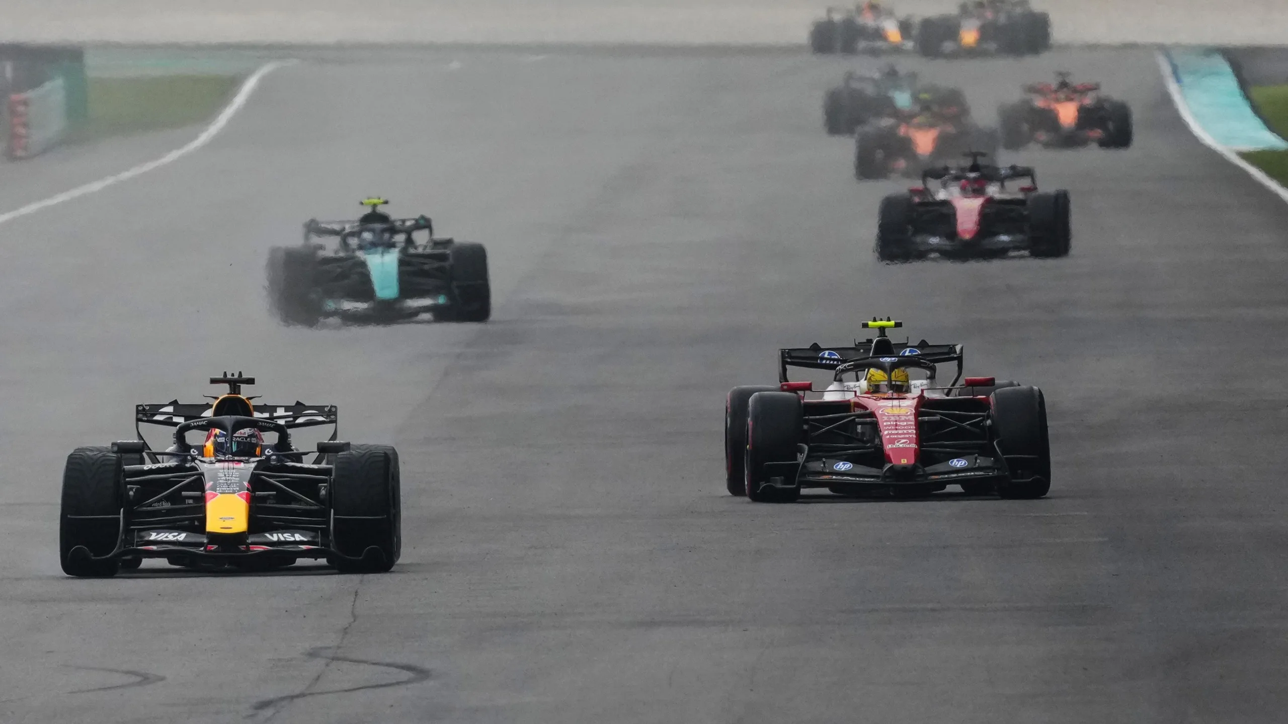 Red Bull's Max Verstappen leads the field, with Ferrari's Lewis Hamilton behind, during the formation lap before the Bahrain Grand Prix in Malaysia