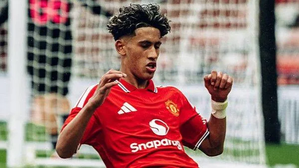 JJ Gabriel celebrates scoring his hat-trick for Manchester United in their UEFA Youth League game against Sabah FK at Leigh Sports Village on 10 September