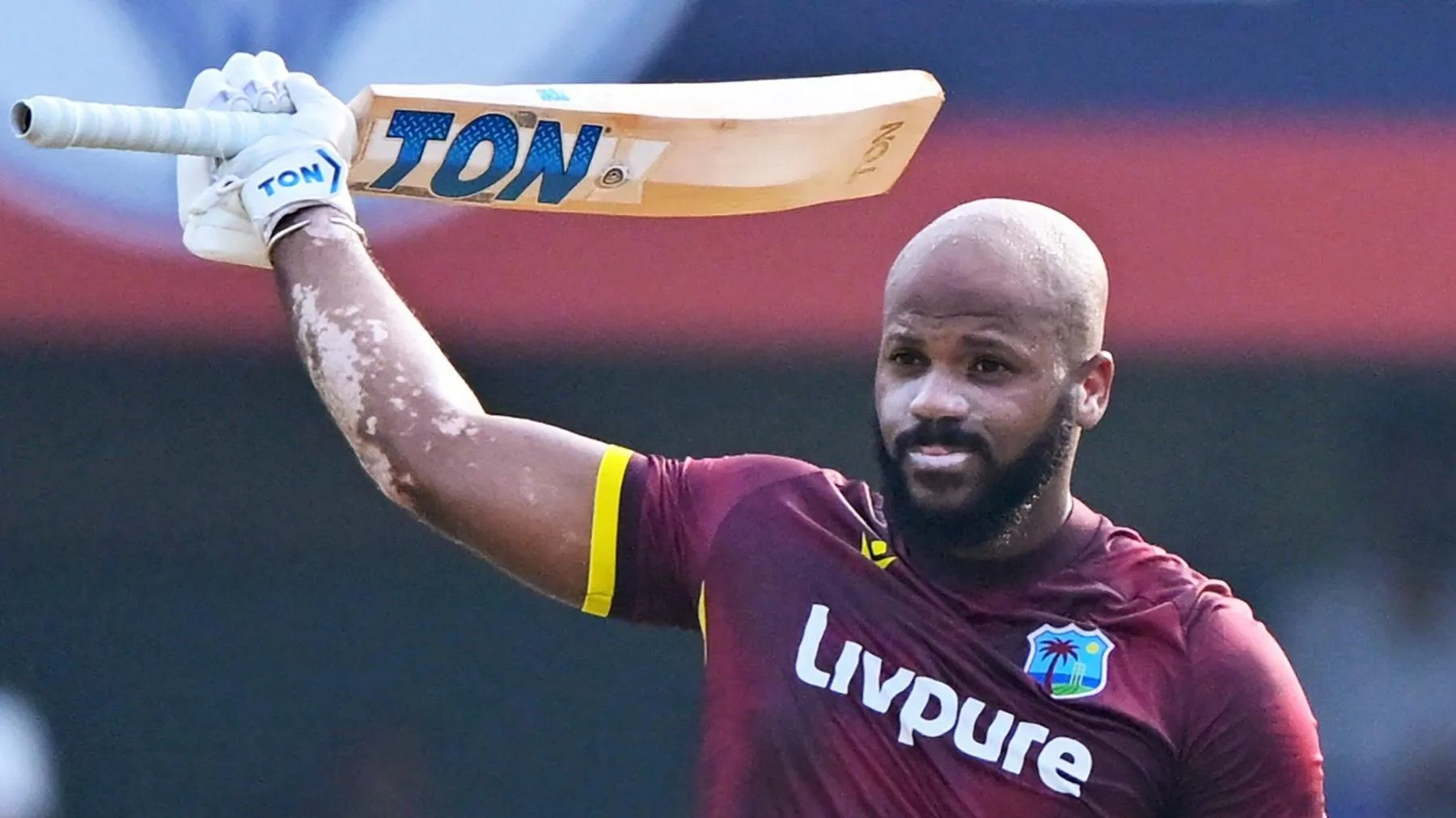 John Campbell raises his bat