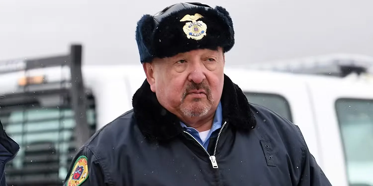 Graham Greene in a tribal police uniform in Wind River.