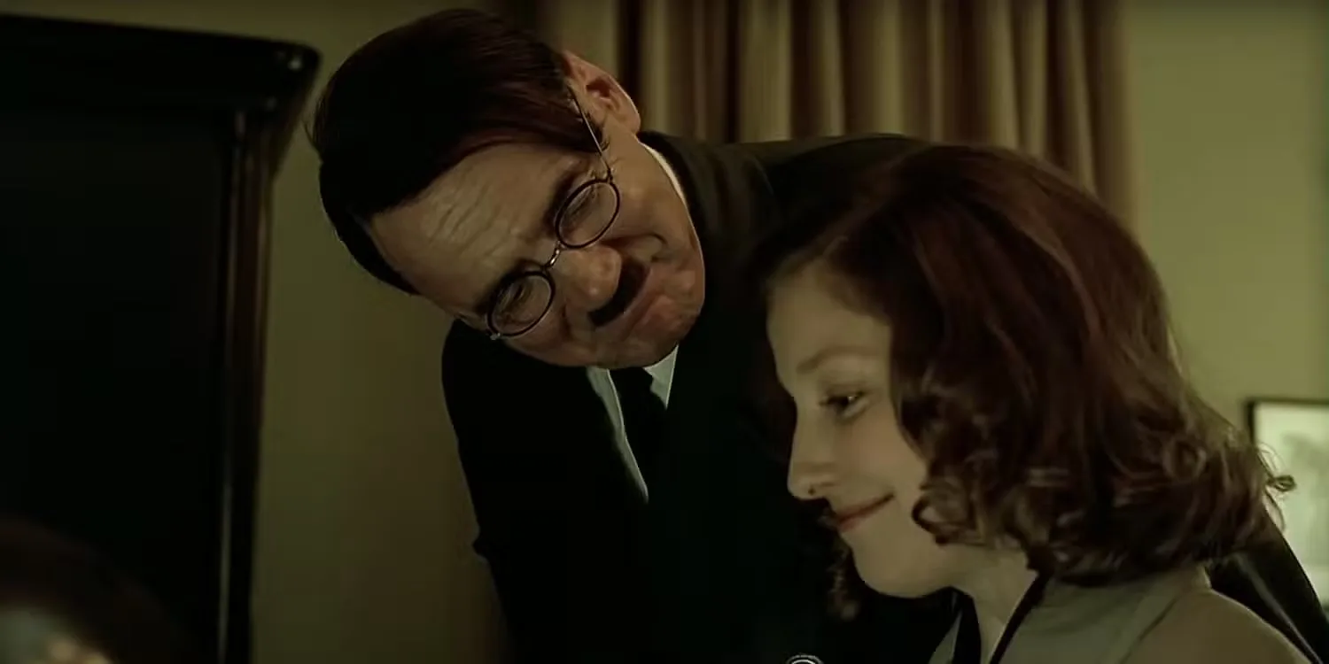 Bruno Ganz as Adolf Hitler looks down at Alexandra Maria Lara as Traudl Junge in Downfall