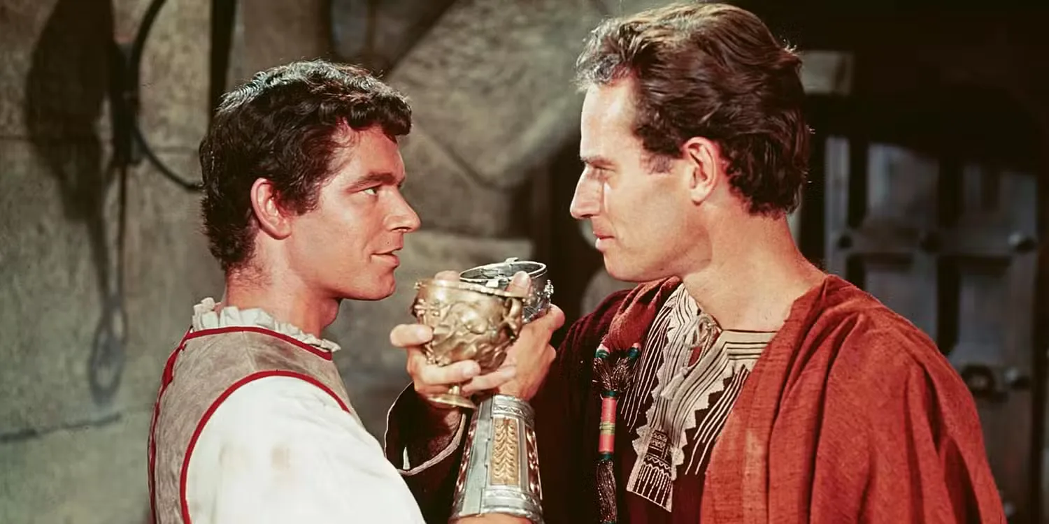 Messala (Stephen Boyd) and Judah Ben-Hur (Charlton Heston) share a drink in 'Ben-Hur' (1959)