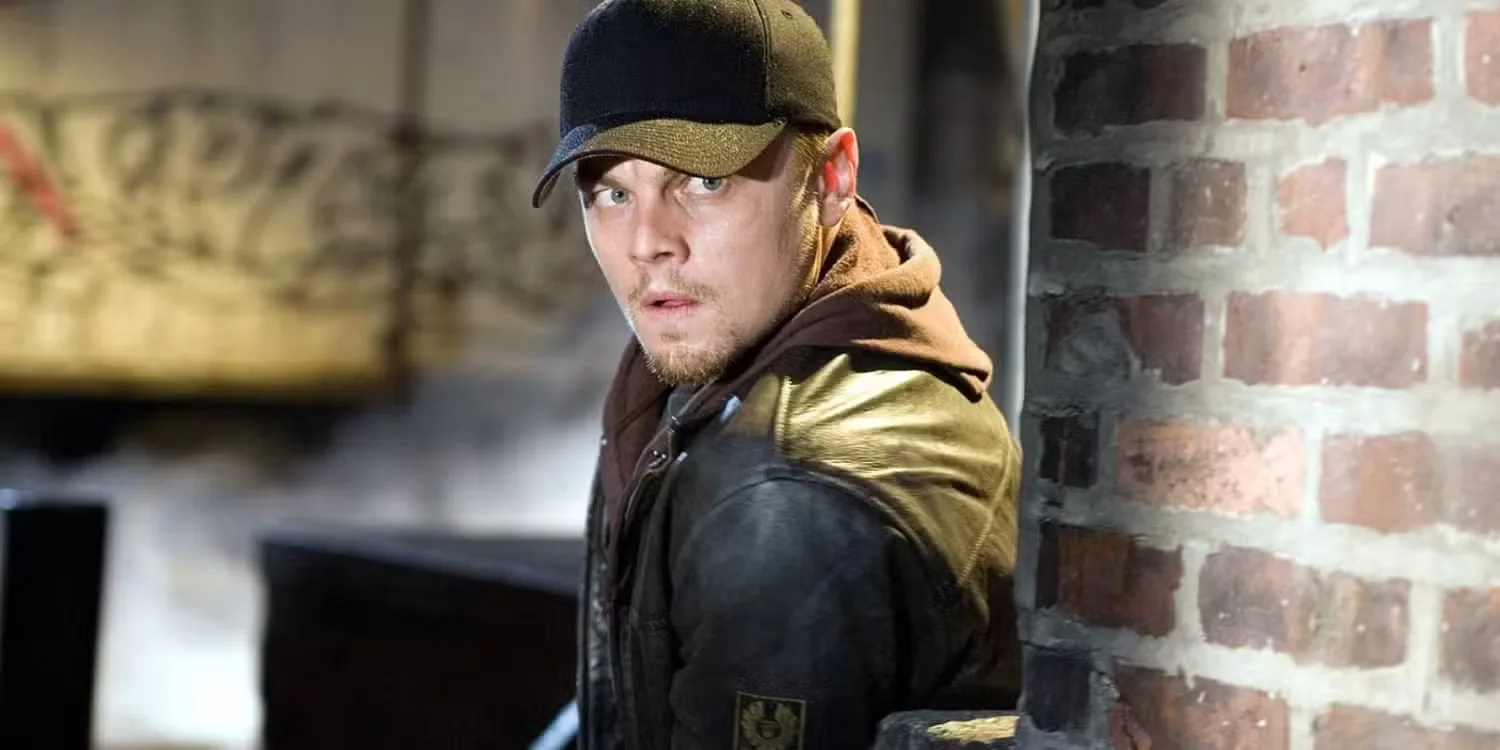 Leonardo DiCaprio in The Departed, looking shady with gun 