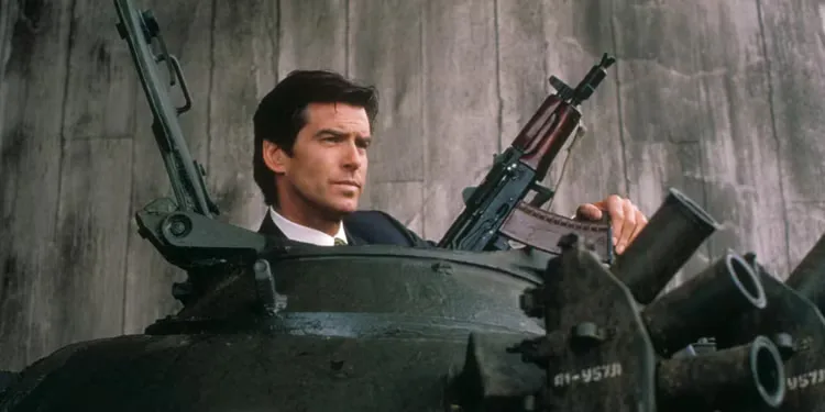 007 (Pierce Brosnan) holding several guns while coming out of a tank in Goldeneye