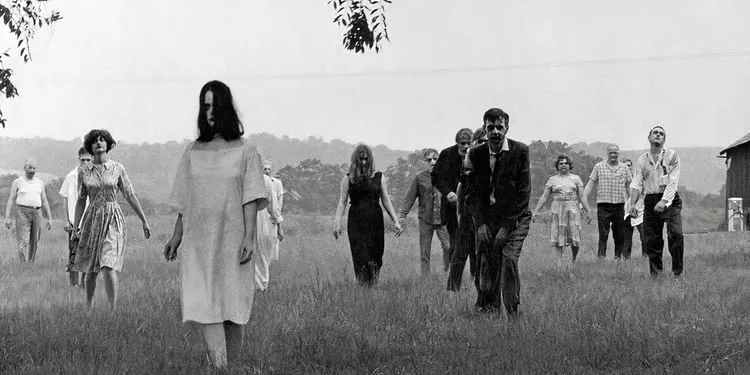 A horde of zombies walks towards the camera in Night of the Living Dead (1968).