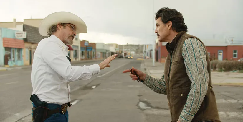 Sheriff Joe Cross and Mayor Ted Garcia at arguing on a main street in Eddington