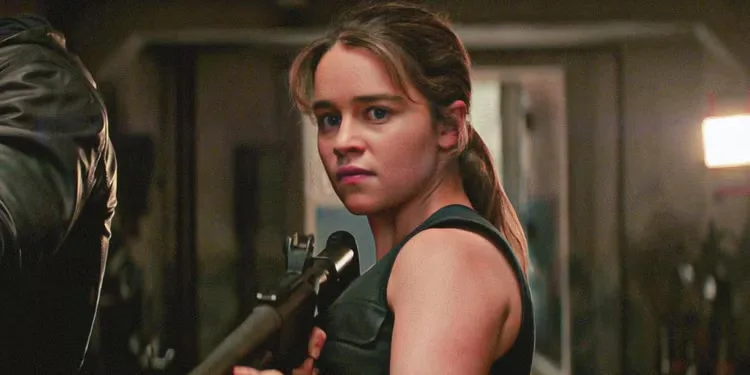 Emilia Clarke as Sarah Connor, holding a gun, in 'Terminator: Genisys'.