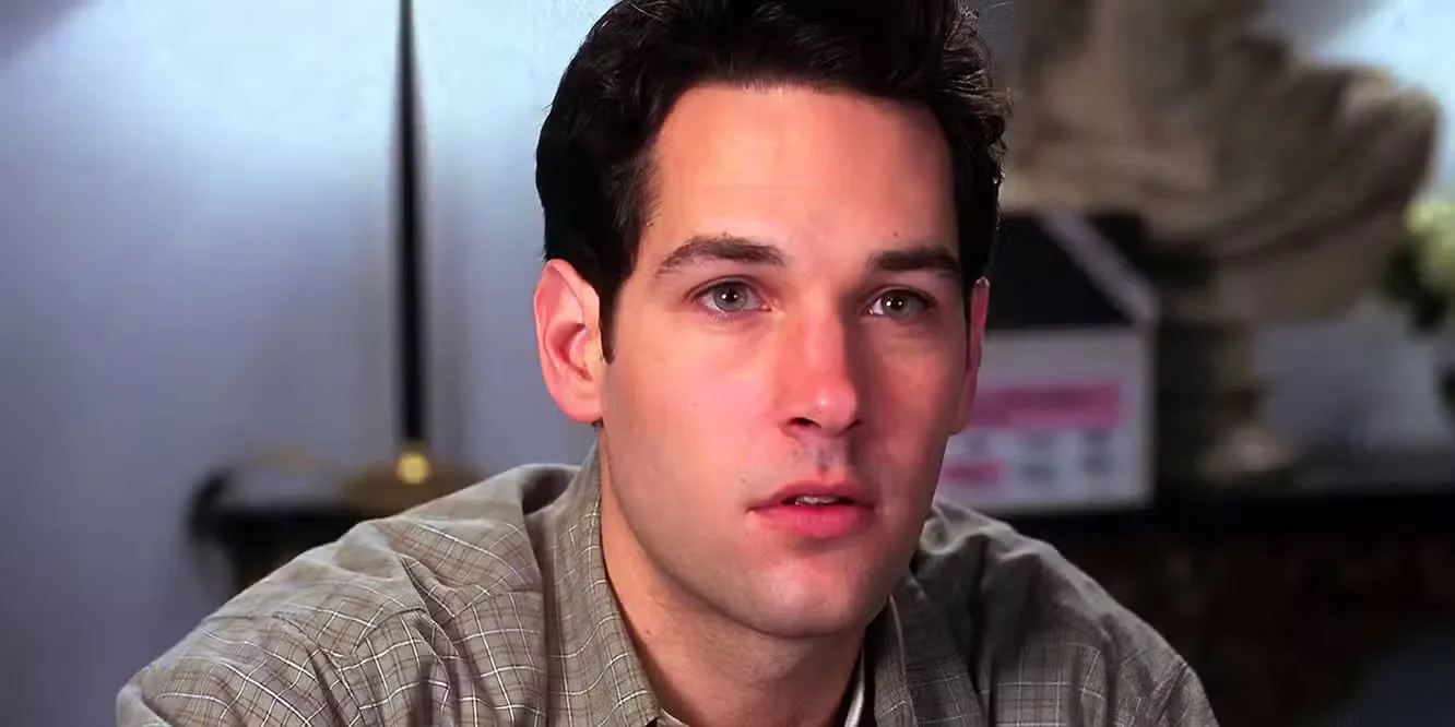 Paul Rudd as Josh looking at someone off camera, in love, in Clueless.