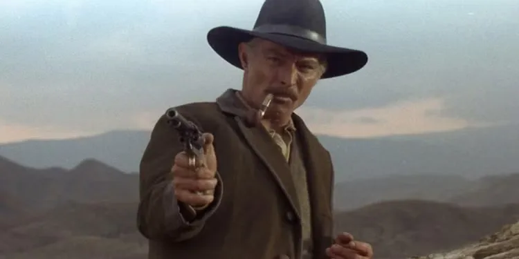 Lee Van Cleef as Ryan holds a gun in 'Death Rides a Horse' (1967)