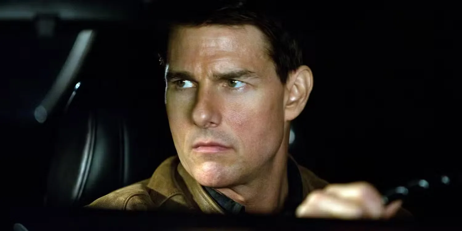 Tom Cruise gripping the wheel as Jack Reacher in Jack Reacher