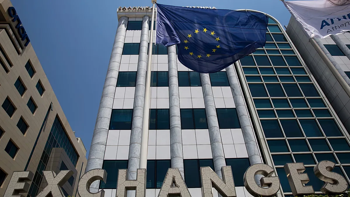 File - A European flag flutters outside the building of the Stock Exchange, in Athens, Friday, 24 June 2016.