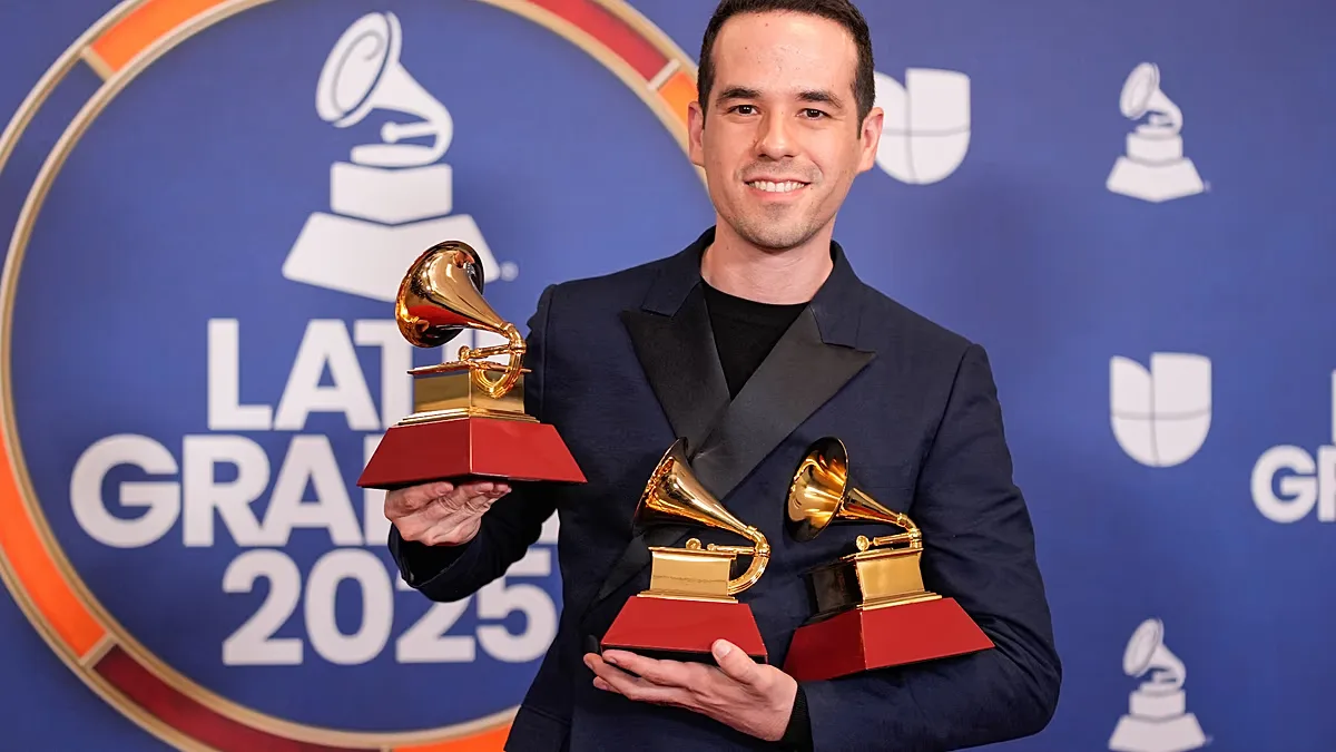 Edgar Barrera poses with the awards he received at the 2025 gala