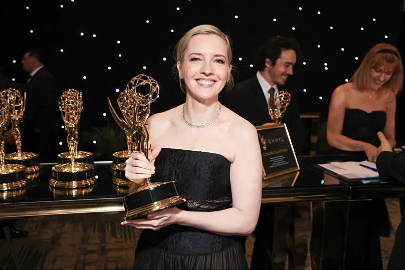 Katie Dippold pics up the official Emmy statuette for Widow's Bay during the Television Academy's 78th Emmy Awards, Sep 14, 2026