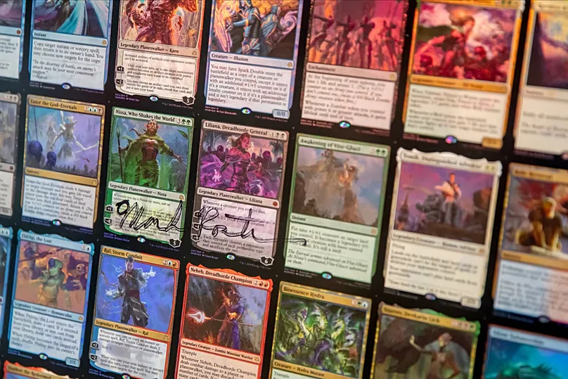 A sheet with several cards from the game 'Magic: The Gathering'
