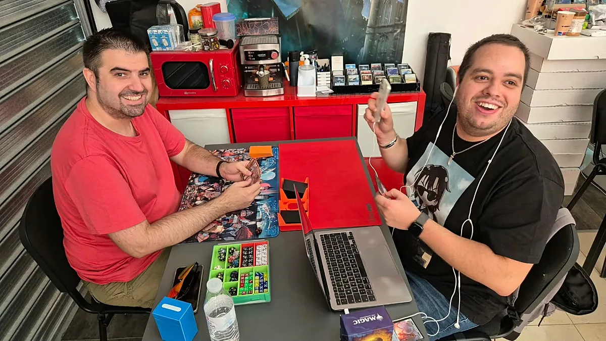 Cristian, with a friend, playing a game of Magic: The Gathering