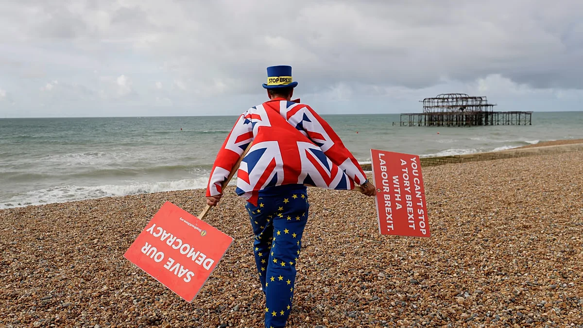 FILE. Anti Brexit campaigner Steve Bray walks on the beach to pose for a photograph during the Labour Party Conference at the Brighton Centre, England, Sept. 2019