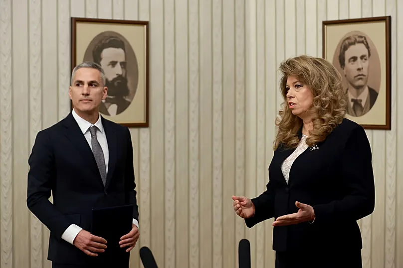 Incumbent Bulgarian President Iliana Yotova (right) appointing current presidential candidate Andrey Gyurov (left) as caretaker Prime Minister on 12 February 2026.