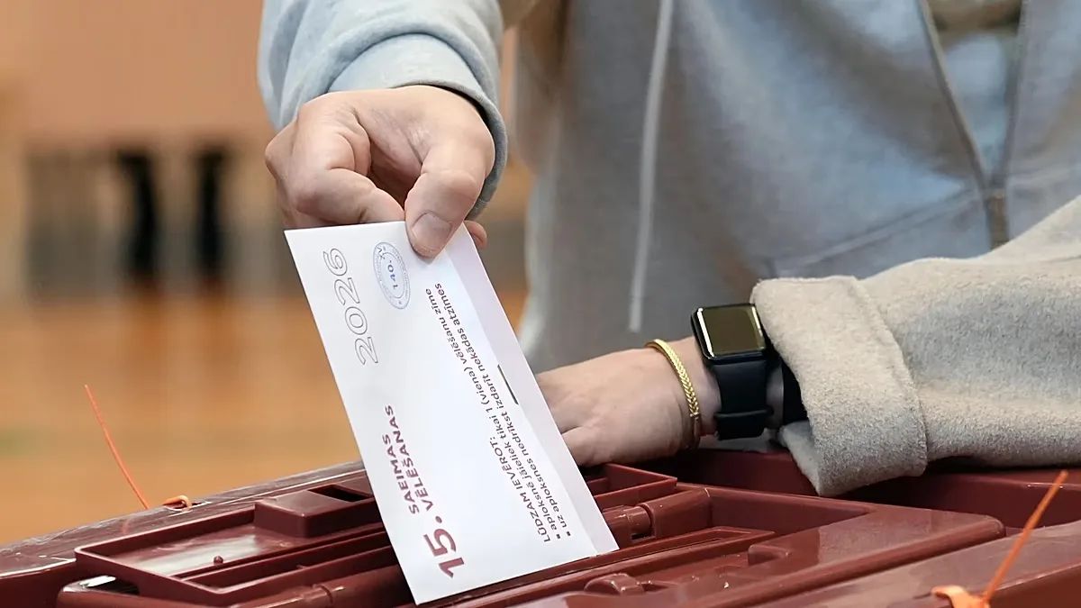 A voter casts his ballot at the parliamentary election at a polling station in Riga, Latvia, Saturday, Oct. 3, 2026.