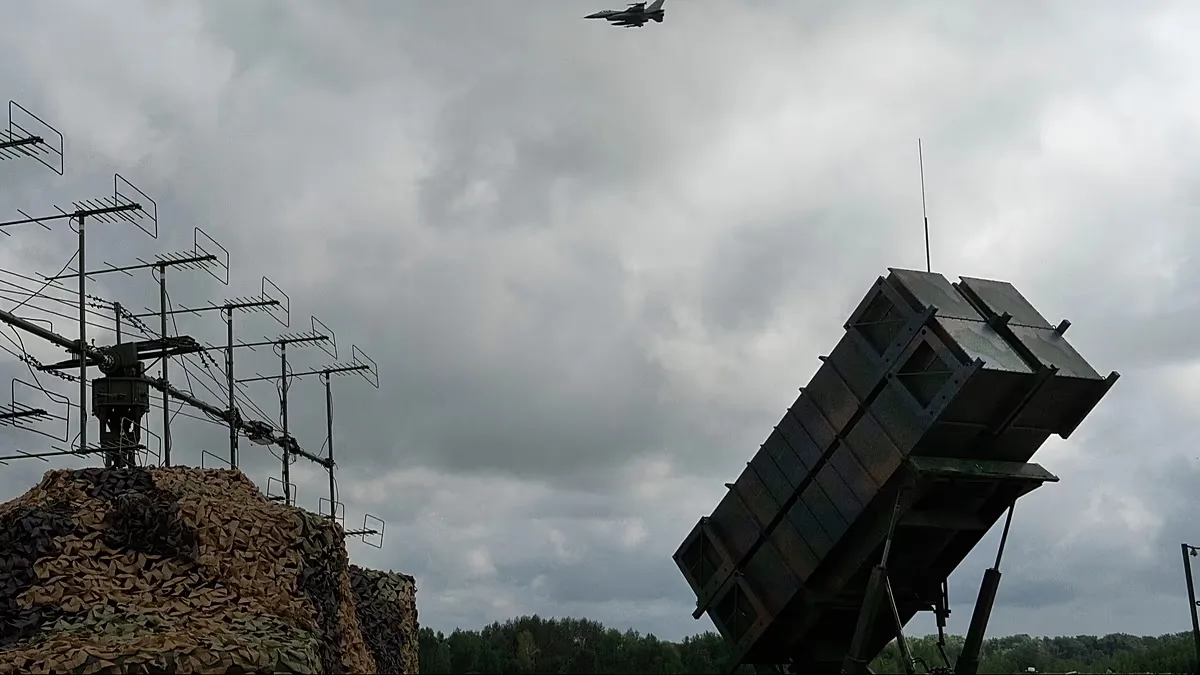 Ukrainian Air Force's F-16 fighter jets fly over a Patriot Air and Missile Defense System in an undisclosed location in Ukraine, on Aug. 4, 2024.
