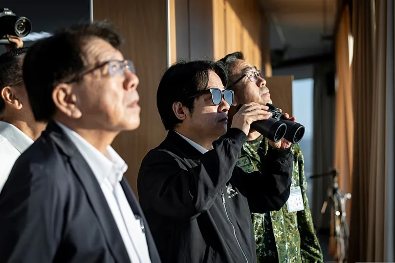Taiwan's President William Lai Ching-te uses binoculars as he inspects a missile launch exercise held at a base in Pingtung county in southern Taiwan, on Friday, Sep. 18, 2026
