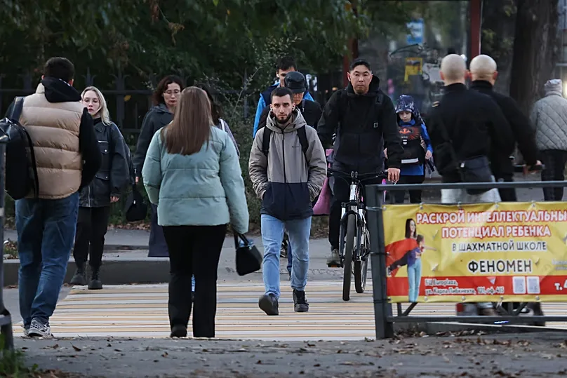 People walk past the building of the Irkutsk Anti-Plague Research Institute in Irkutsk, Russia, on Wednesday 7 October 2026