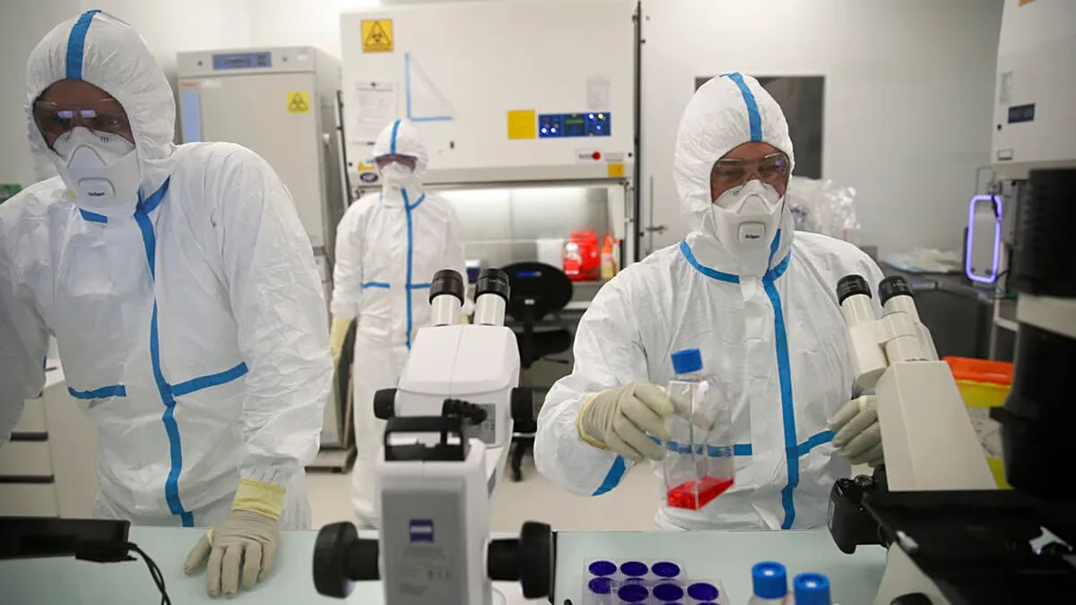 ARCHIVE - Lab technicians work at Valneva's headquarters in Saint-Herblain, western France, on 3 February 2021.