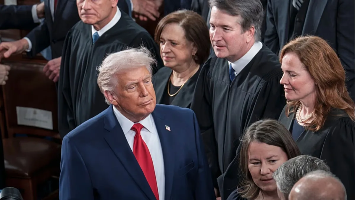FILE - President Trump walks past US Supreme Court justices as he arrives for his State of the Union address, at the Capitol in Washington, Tuesday, Feb. 24, 2026