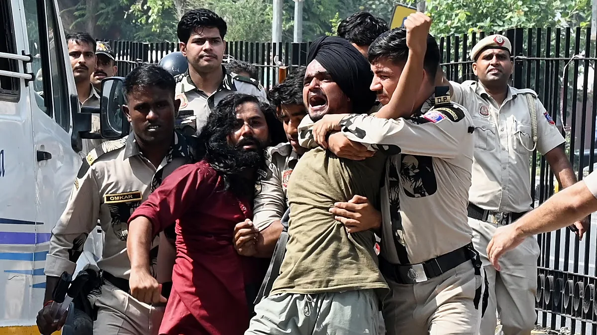 Policemen detain protesters during a youth demonstration demanding the resignation of the country's election chief Gyanesh Kumar, in New Delhi, India, Saturday, Oct. 10, 2026.