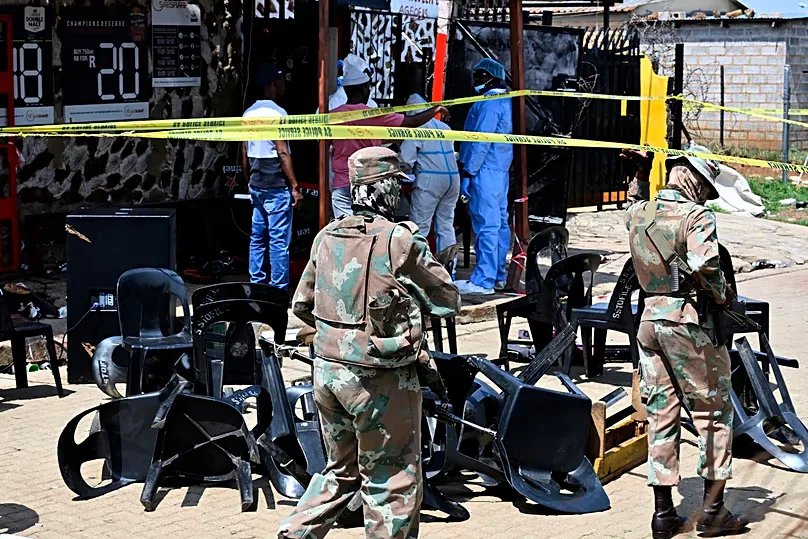 Forensic officers and the army at the scene of a mass shooting at a bar in Wedela township, 27 September, 2026