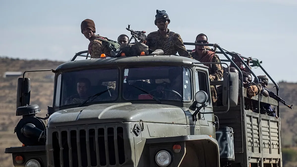 FILE: Ethiopian government soldiers ride in the back of a truck on a road near Agula, north of Mekele, in the Tigray region of northern Ethiopia on 8 May 2021