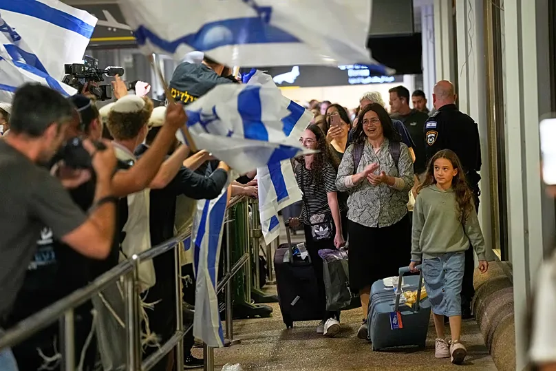 Israeli passengers who had been aboard a flydubai aircraft are welcomed at Ben Gurion International Airport near Tel Aviv, 30 September, 2026