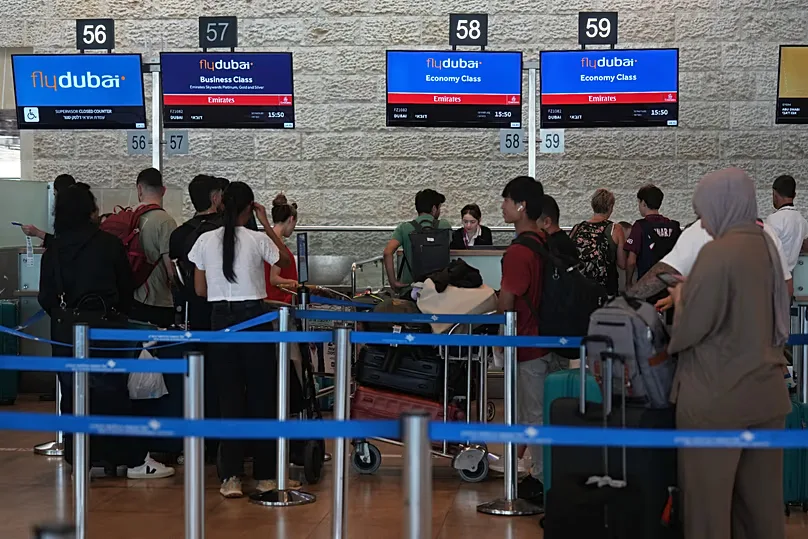 Passengers wait in line to check in their luggage with flydubai at Ben Gurion International Airport near Tel Aviv, 30 September, 2026