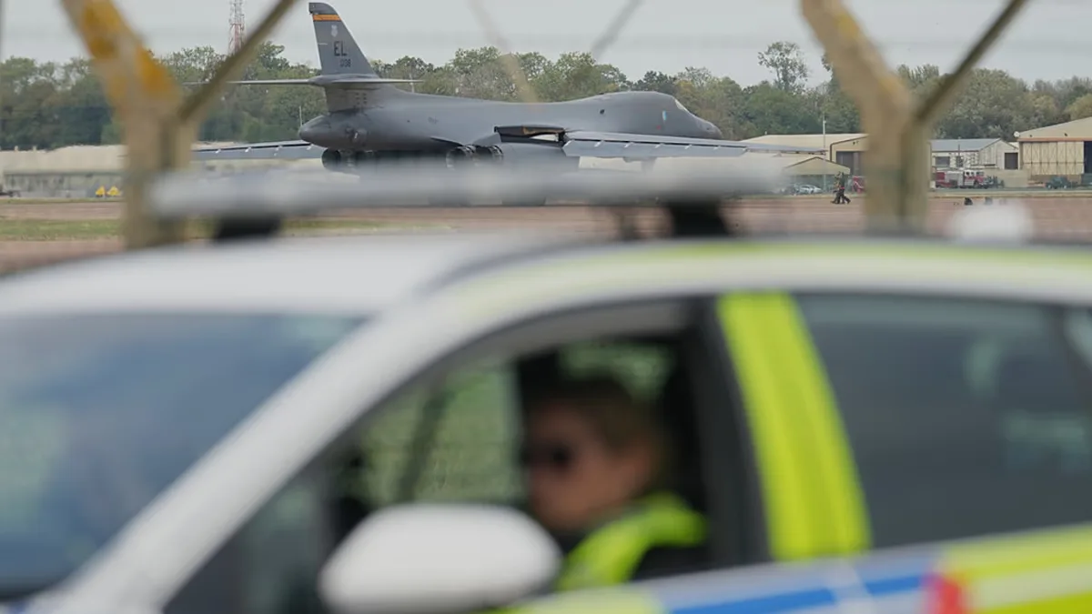 A B1 bomber prepares to take off as police officers man a checkpoint near RAF Fairford air base, in Fairford, England Tuesday, Sept. 29, 2026