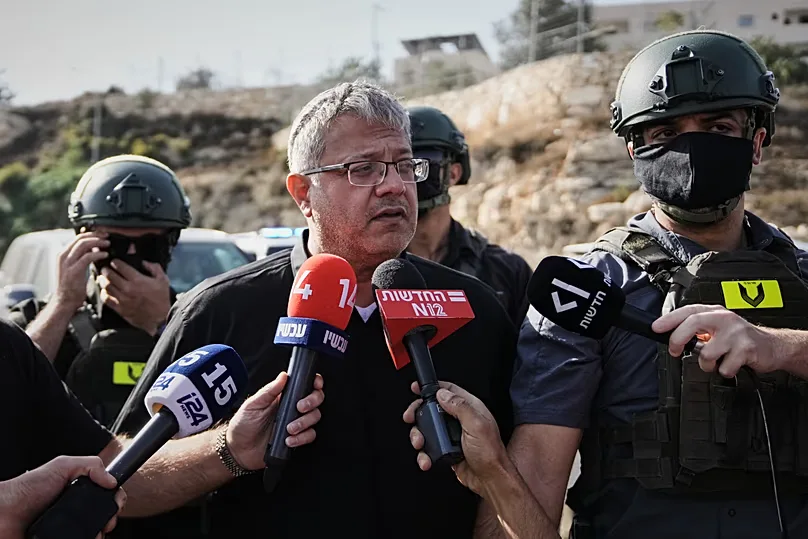 Israeli National Security Minister Itamar Ben-Gvir speaks to the media at the scene of a shooting  near Hebron 