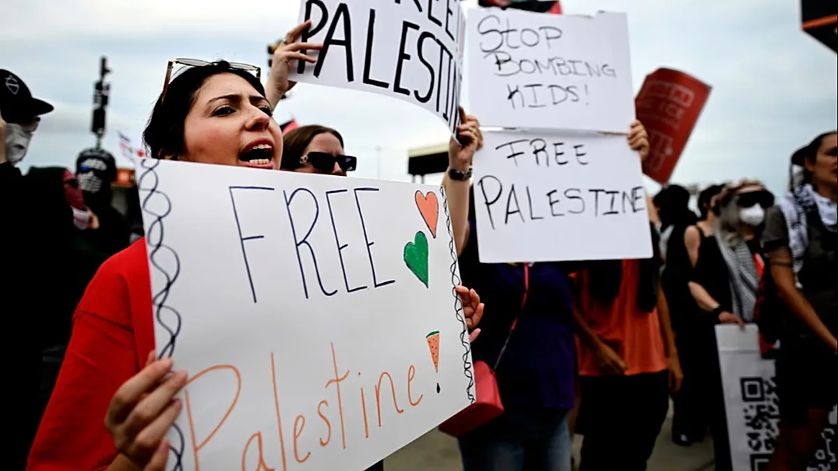 Pro-Palestinian demonstrators hold signs during a "Free Palestine" protest before an Ed Sheeran concert in Philadelphia, Saturday, Sept. 19, 2026