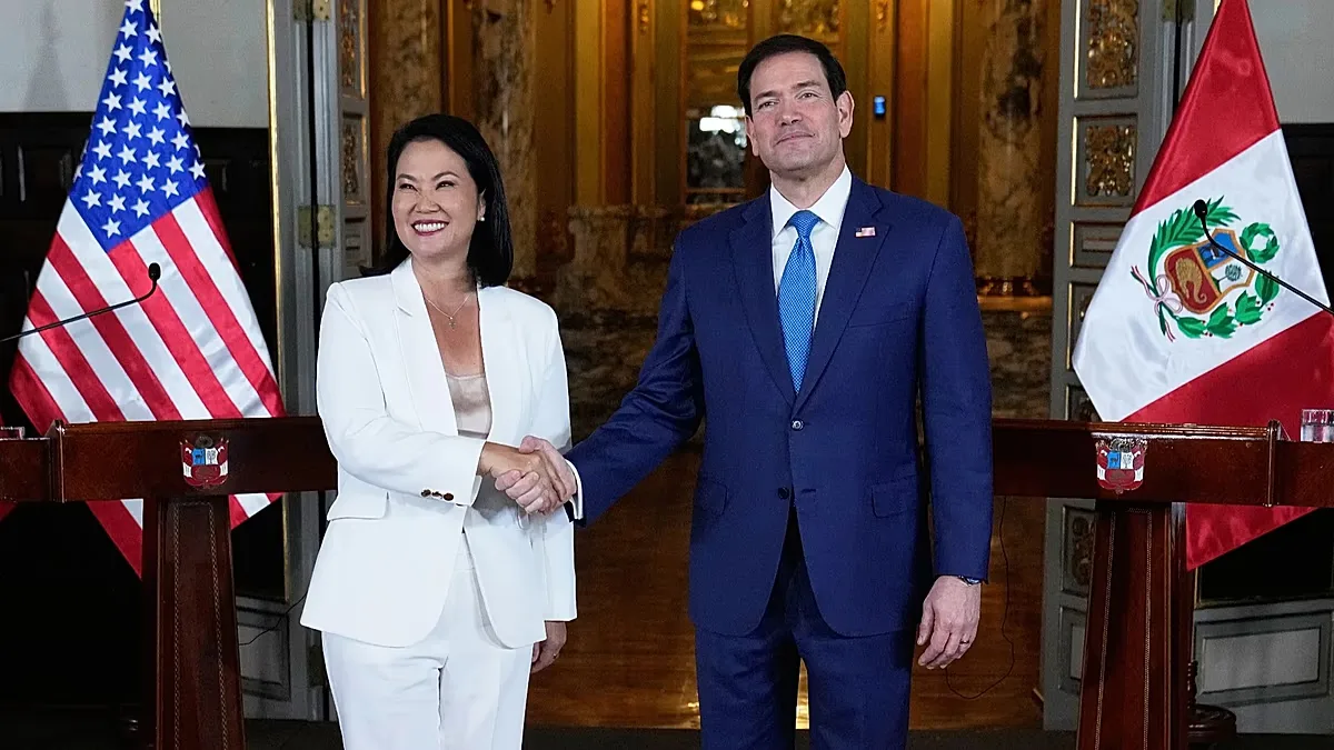 U.S. Secretary of State Marco Rubio, right, and Peruvian President Keiko Fujimori shake hands after a joint news conference at the presidential palace in Lima, Peru.