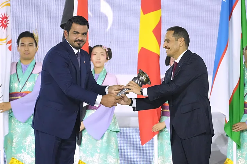 OCA President Sheikh Joaan bin Hamad Al Thani hands the Asian Games torch to Qatar's Prime Minister Sheikh Mohammed bin Abdulrahman Al Thani in Nagoya, Japan on 4 Oct., 2026.