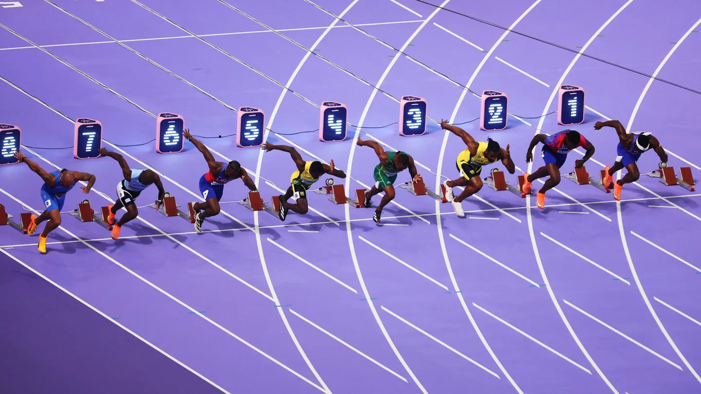 Sprinters start the 100 meter dash, a race that relies on reaction time.
