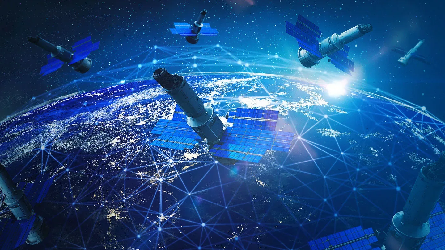An illustration showing a cluster of satellites orbiting above Earth.
